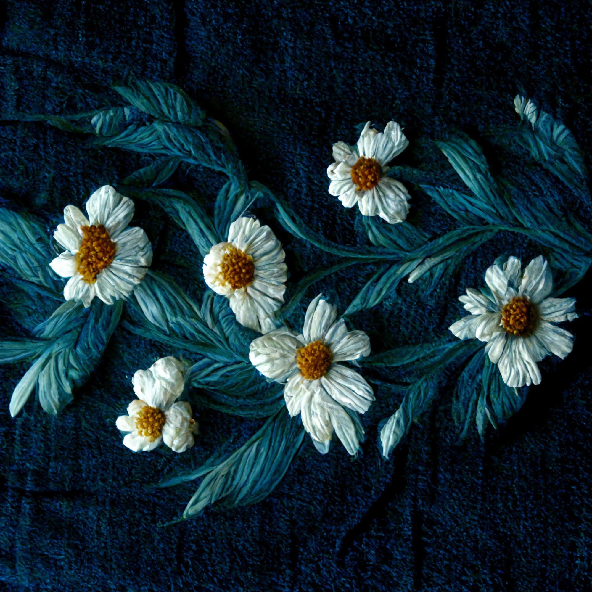 embroidered floral motif on dark fabric