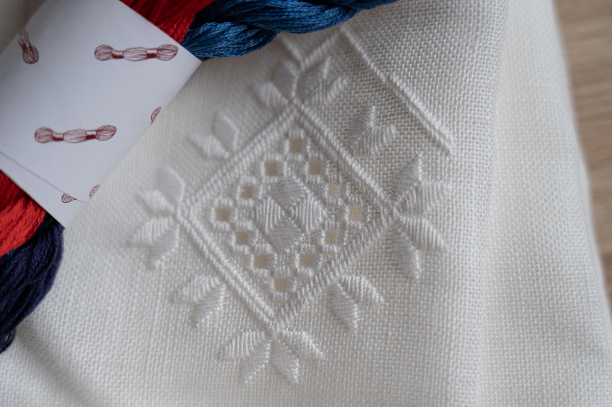 linen with geometric embroidered pattern